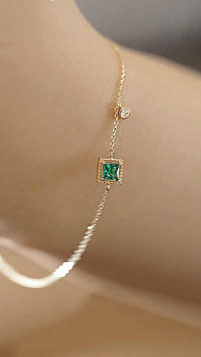 Gold Bracelet with Emerald-Cut Green Gemstone, Pavé Accents, and Bezel-Set Charm