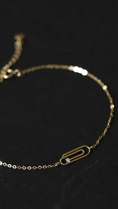 Gold Bracelet with Paperclip Charm and Cubic Zirconia Accent